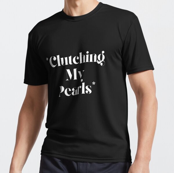 Man in t-shirt with words 'clutching your pearls'. Used to illustrate article about CMO executive alignment.