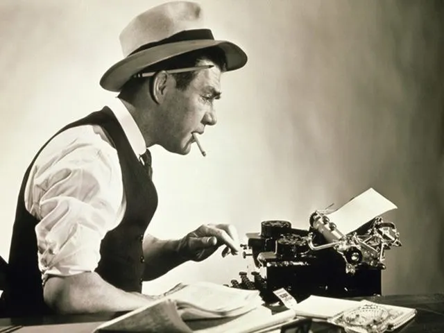 Photo of old time reporter working at typewriter, used to illustrate article on personal branding for exeutives.